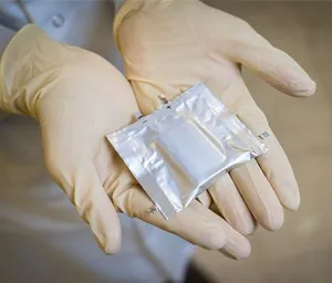 A person holding a package in their hand