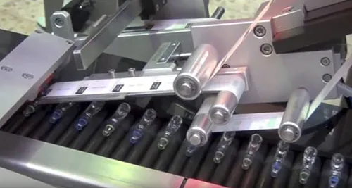 Vial labelling machine