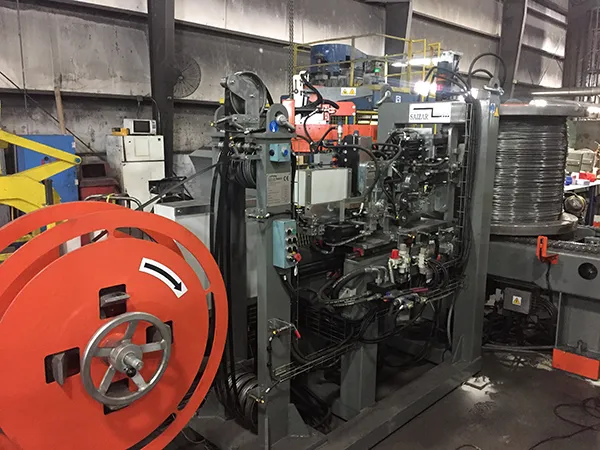 AUTOMATIC STRAPPING SOLUTIONS FOR COILS IN THE SPOOLER