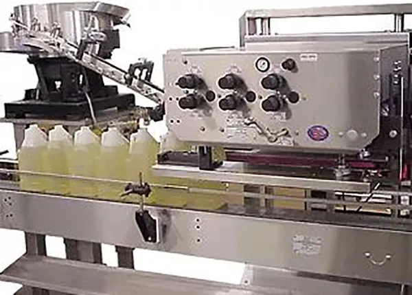 SPINDLE CAPPER